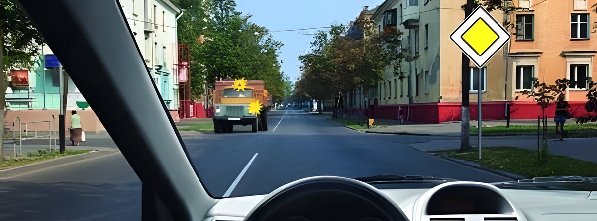 Иллюстрация к вопросу: Обязаны ли мы при проезде перекрёстка прямо уступить дорогу водителю грузового автомобиля с включёнными проблесковыми…